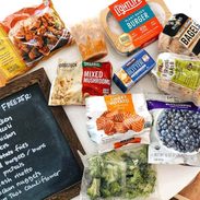 Bags of foods on a white table.
